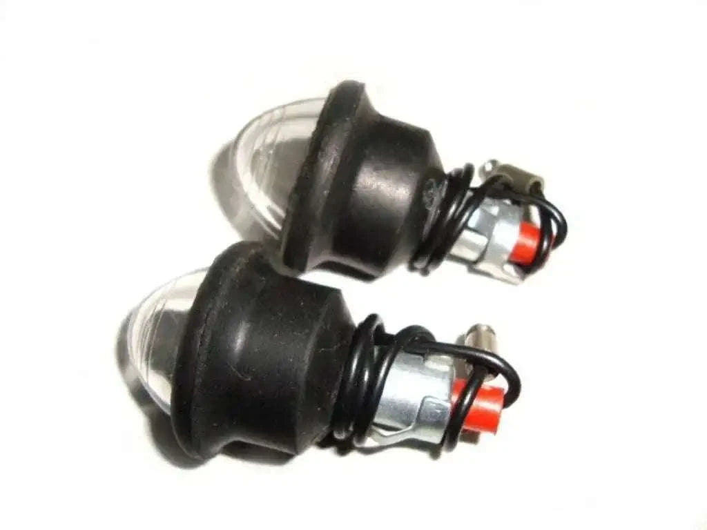 Clear pilot lamp bulbs with black rims and sockets, two-pack