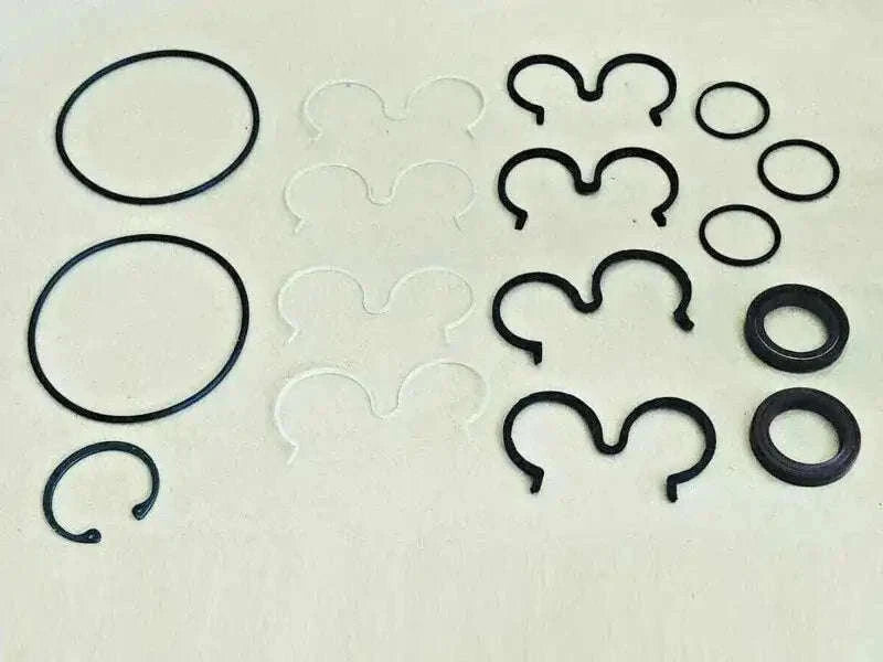 JCB hydraulic pump seal kit featuring black O-rings and molded seals, suited for effective repairs.