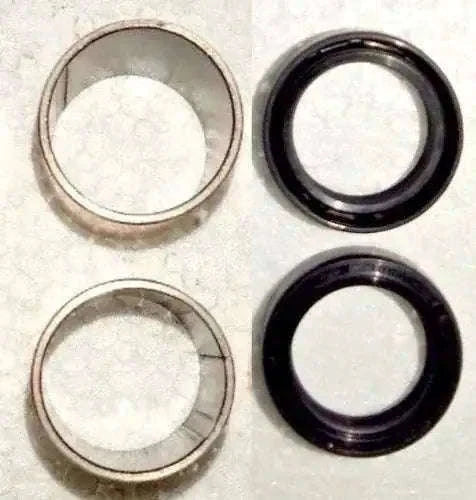 Hydraulic pump seal and bushing kit with metal and black rubber rings