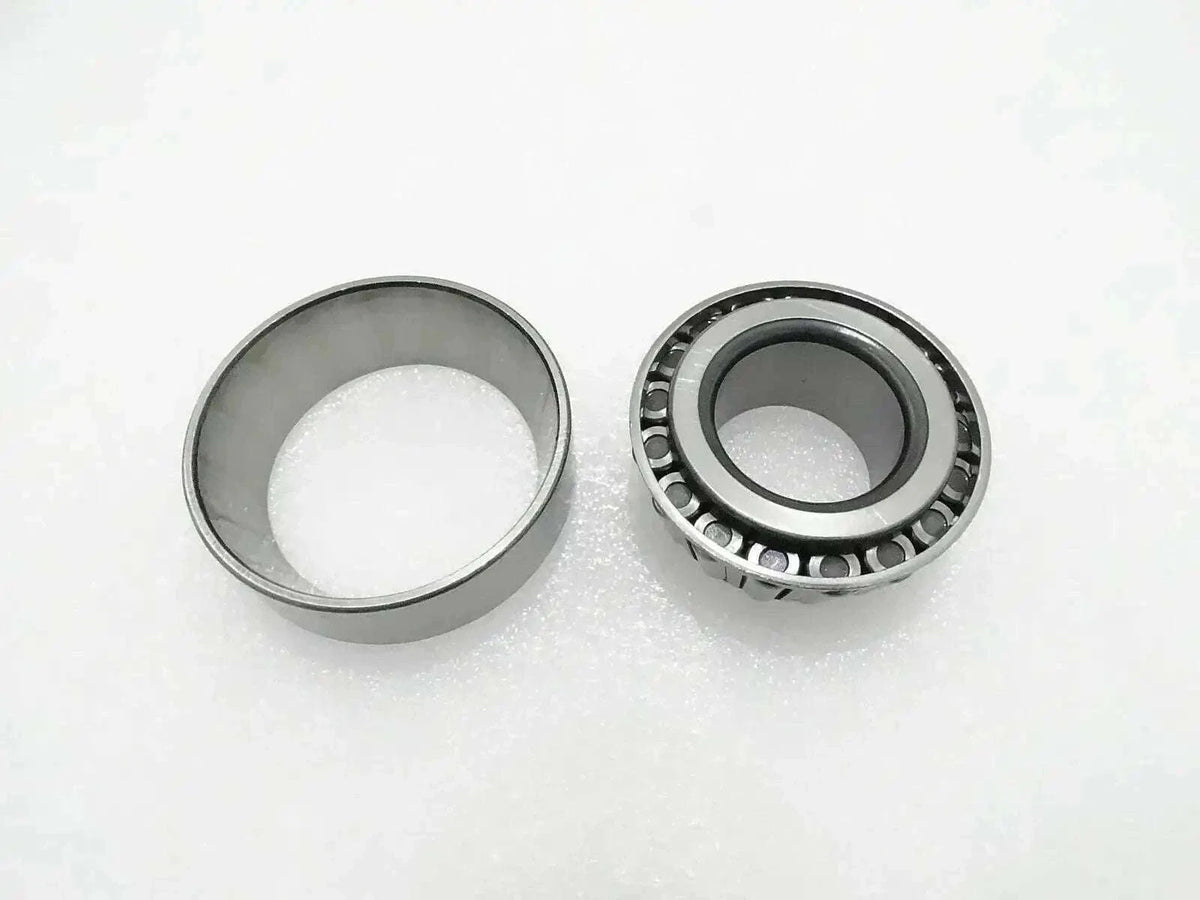 Thrust bearing with metal cage and roller assembly, shown with two rings