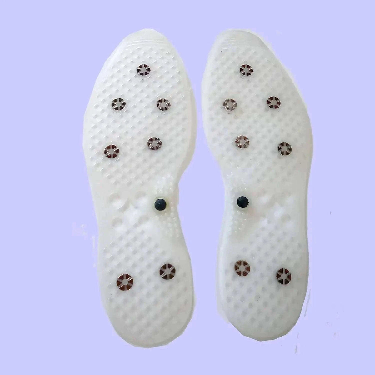 Magnetic acupressure insoles for foot massage and pain relief
