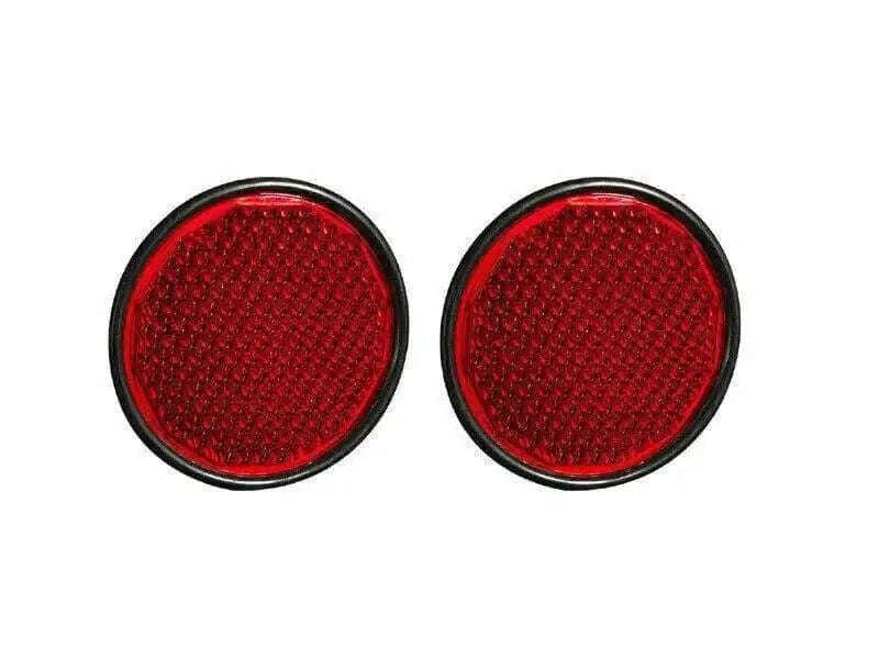 Set of 4 round red reflectors for tractor trailers, enhancing on-road visibility.