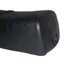 Vespa seat saddle black side close-up with textured finish and rounded end