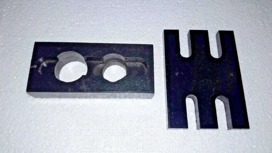 Metal injector adapter plate with two circular holes and forked holder prongs