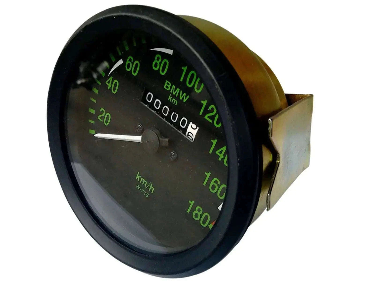 Round black speedometer gauge with green km/h scale up to 180, mounting bracket on side