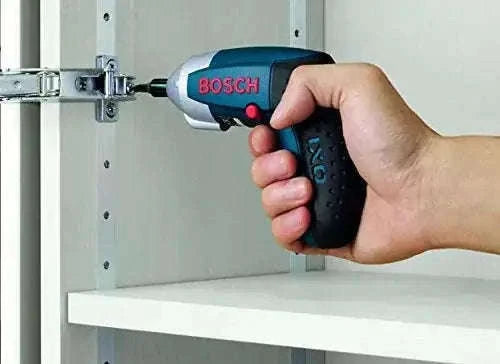 Bosch cordless multipurpose screwdriver with bit, held by hand