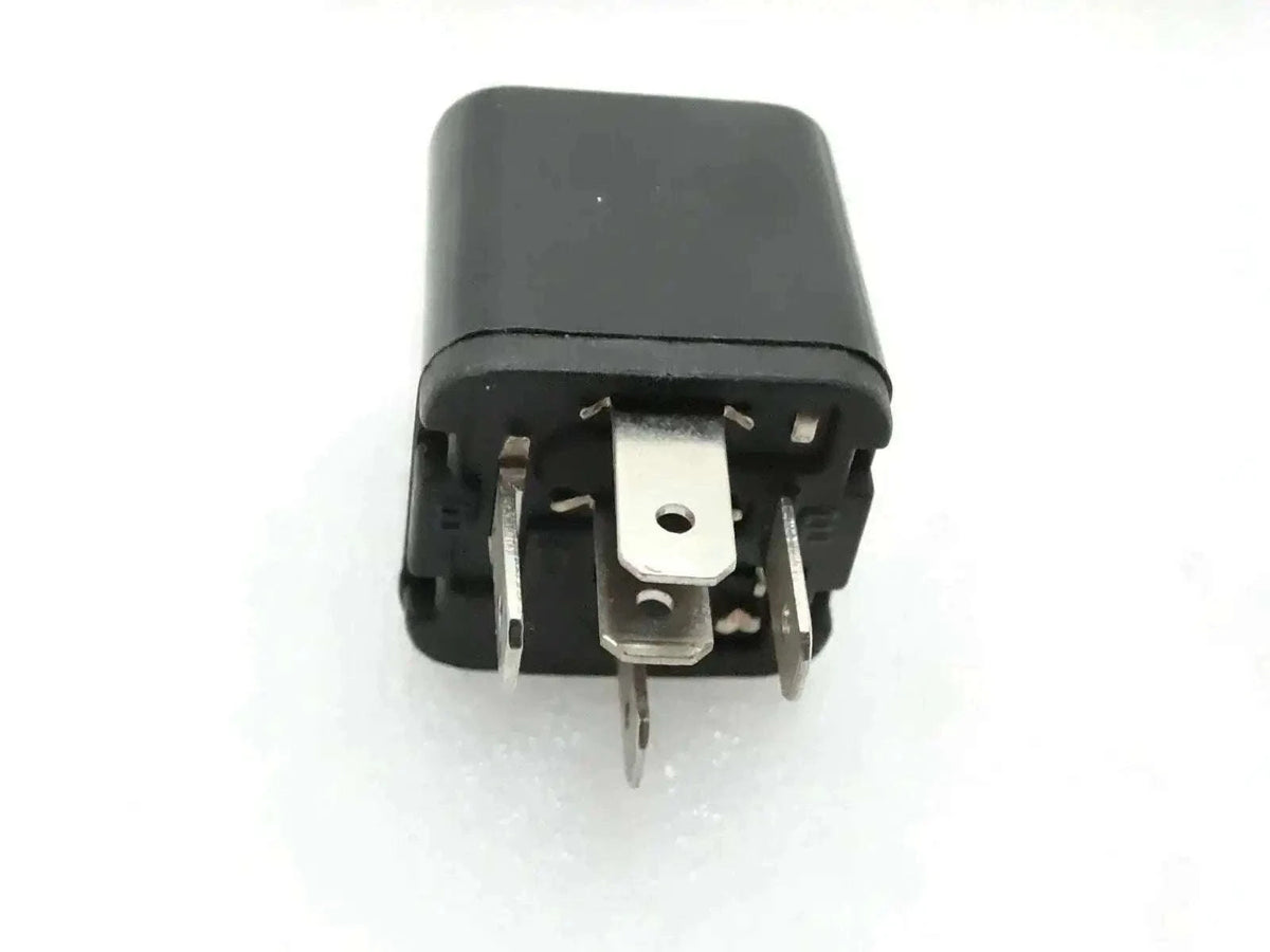 Black automotive relay switch with visible metal terminals