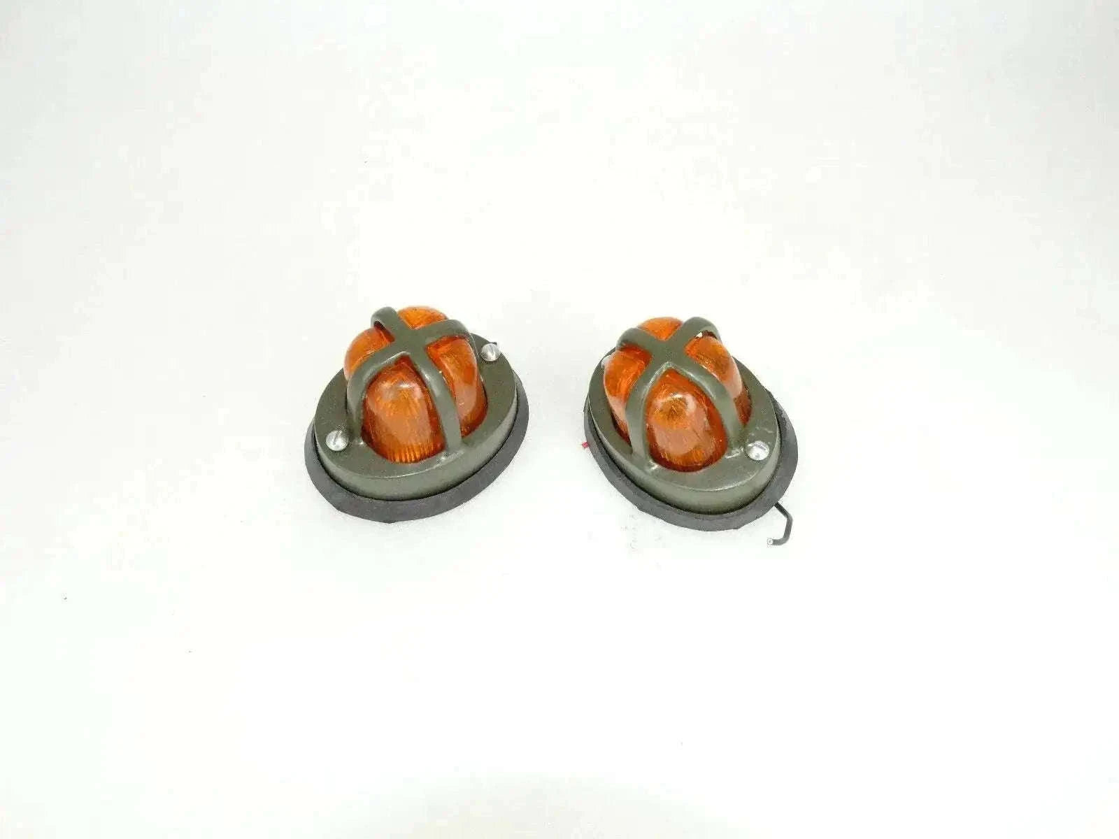 Round orange parking light pair with amber lens and black mounting base
