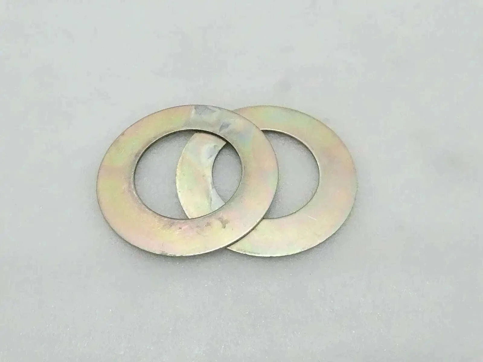 Metal shim washer pair with central holes