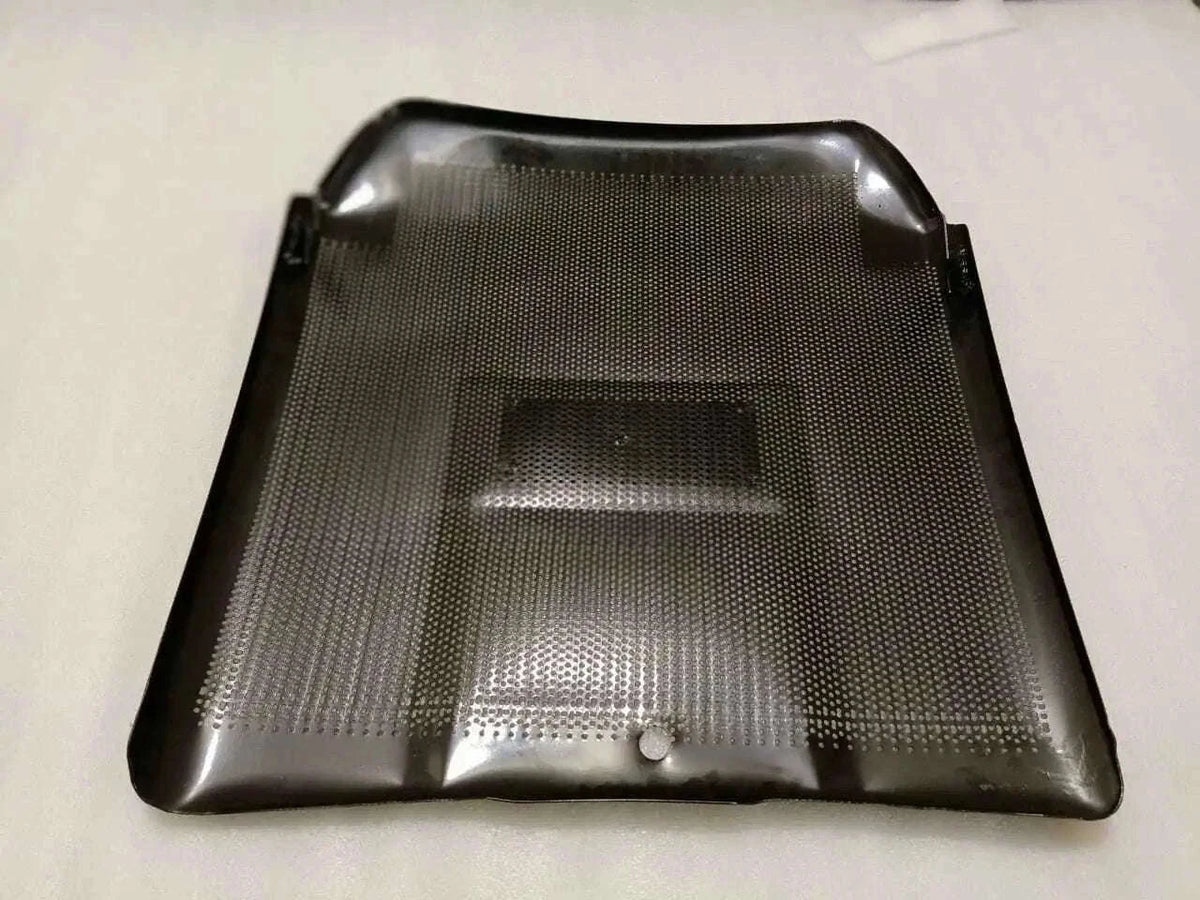 Front grill panel with perforated mesh and central rectangular opening, dark gray