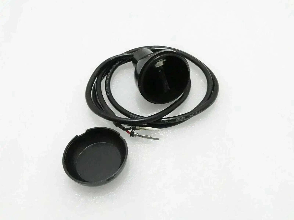 Micro switch with black round actuator cap and attached wire harness