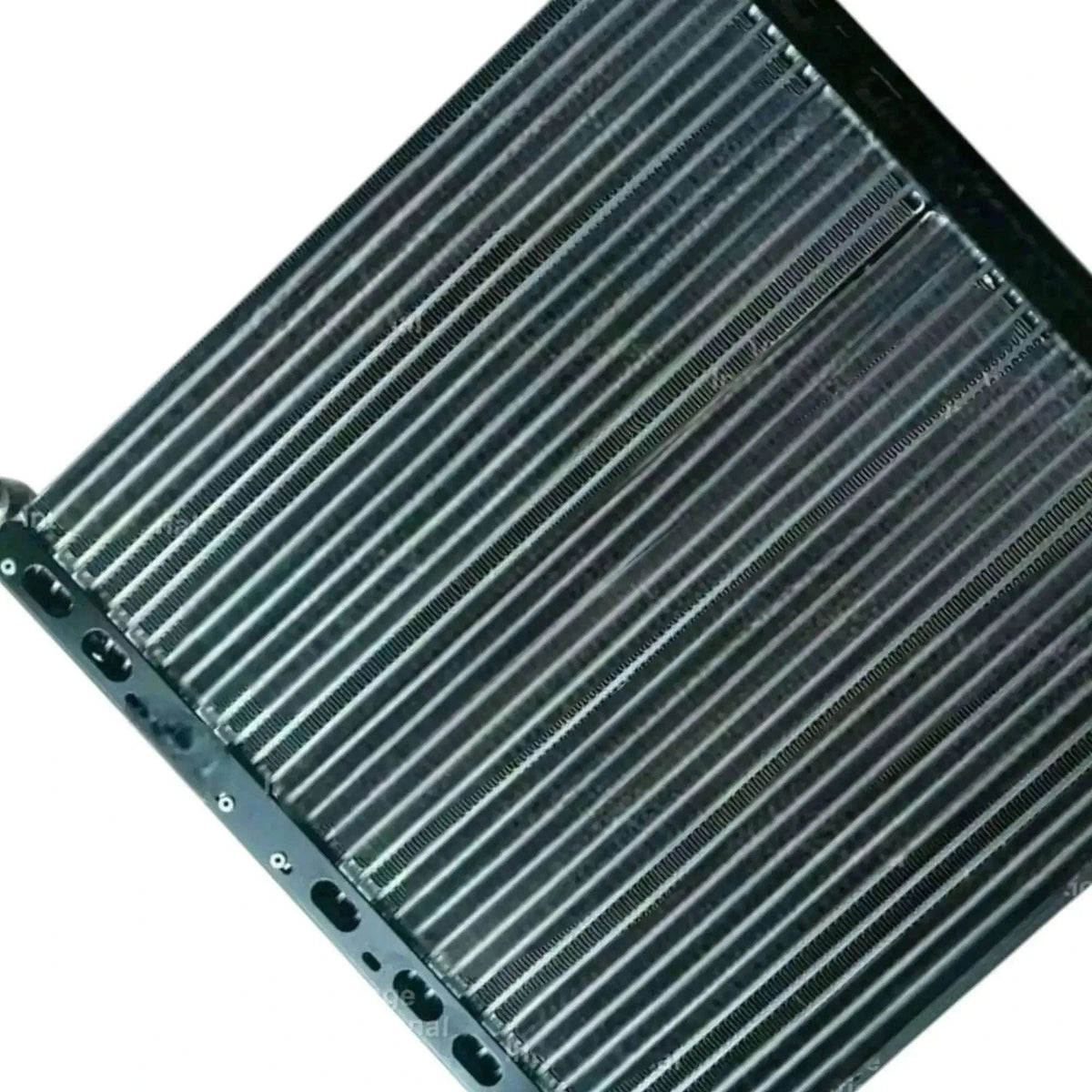Radiator oil cooler side view with closely spaced fins and mounting holes along the edge