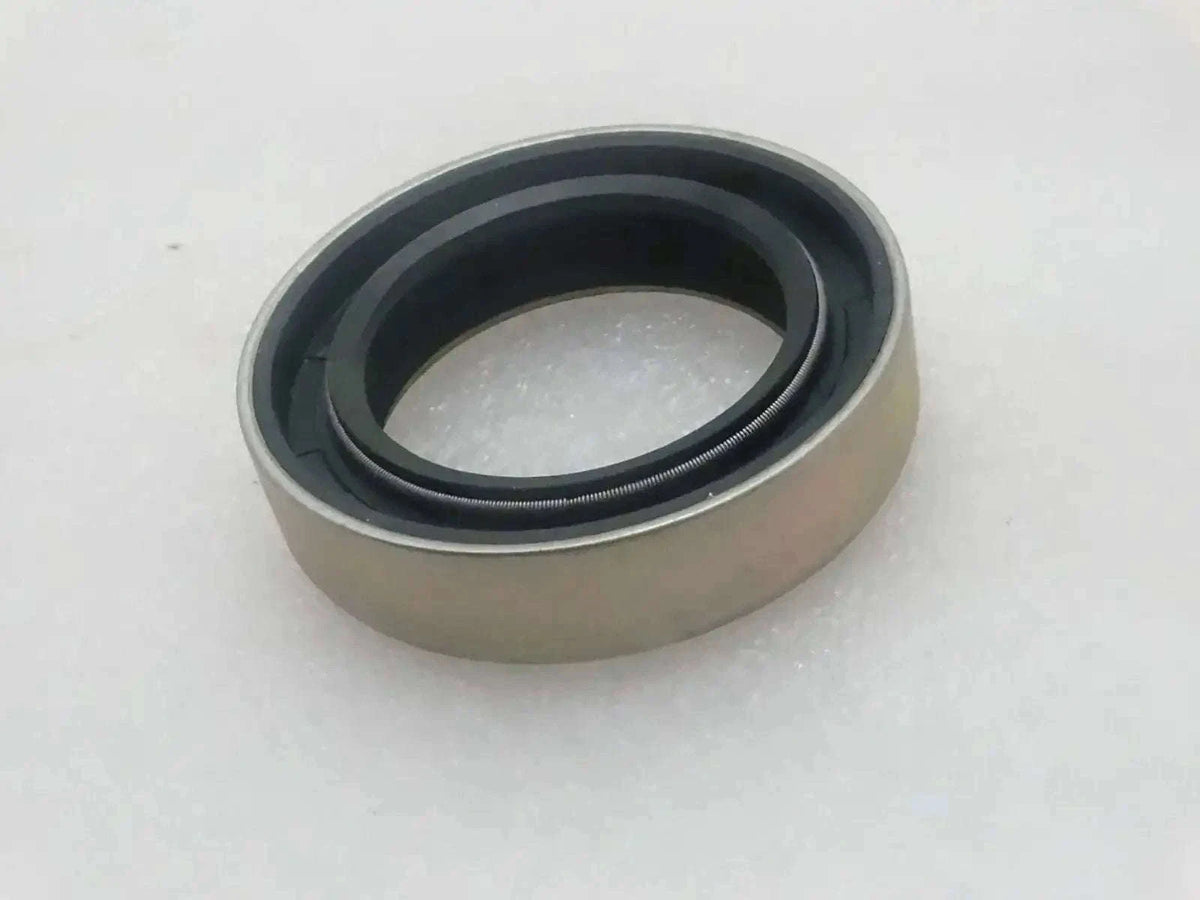 Oil seal with beige housing and dark rubber sealing lip ring