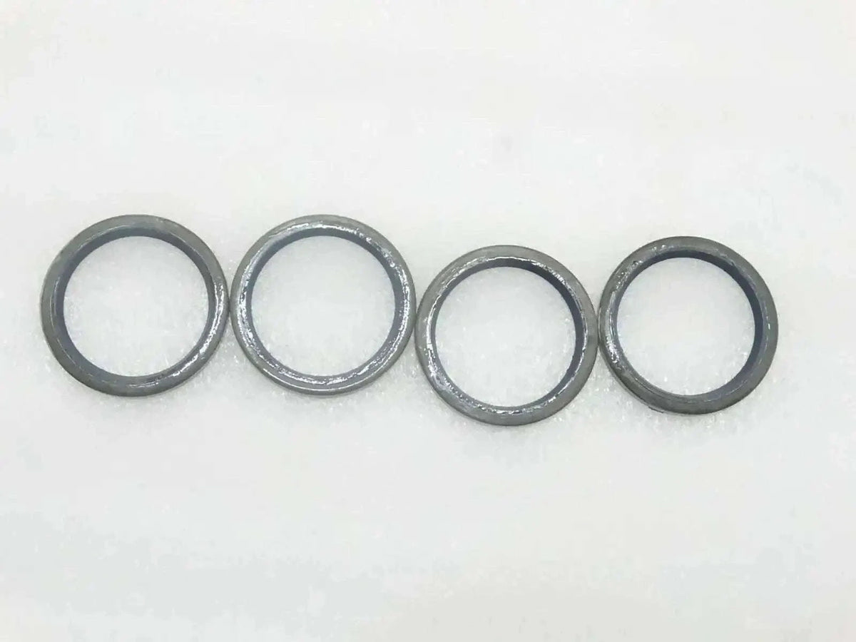JCB seal pivot pin grease set, four durable metal rings for effective lubrication in machinery