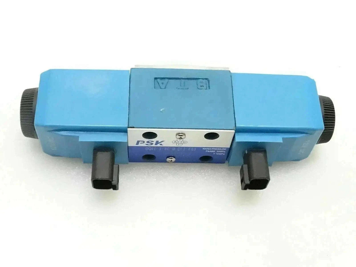 Blue valve solenoid with two front ports and black mounting blocks