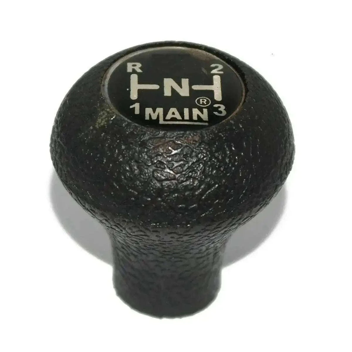 Black textured gear shift knob with gear position markings on top