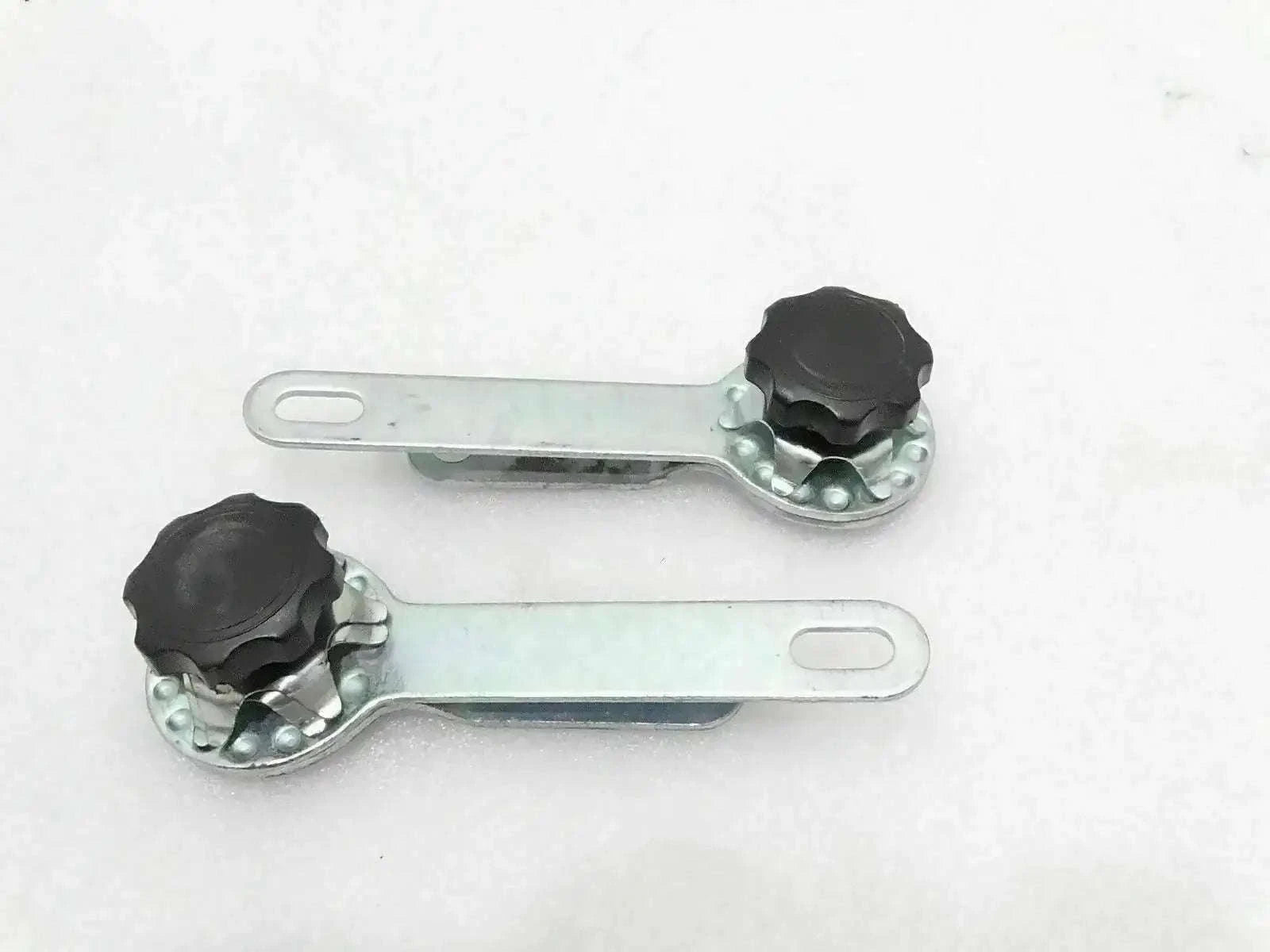 Windshield frame adjusting arm assembly with two metal arms and black locking knobs