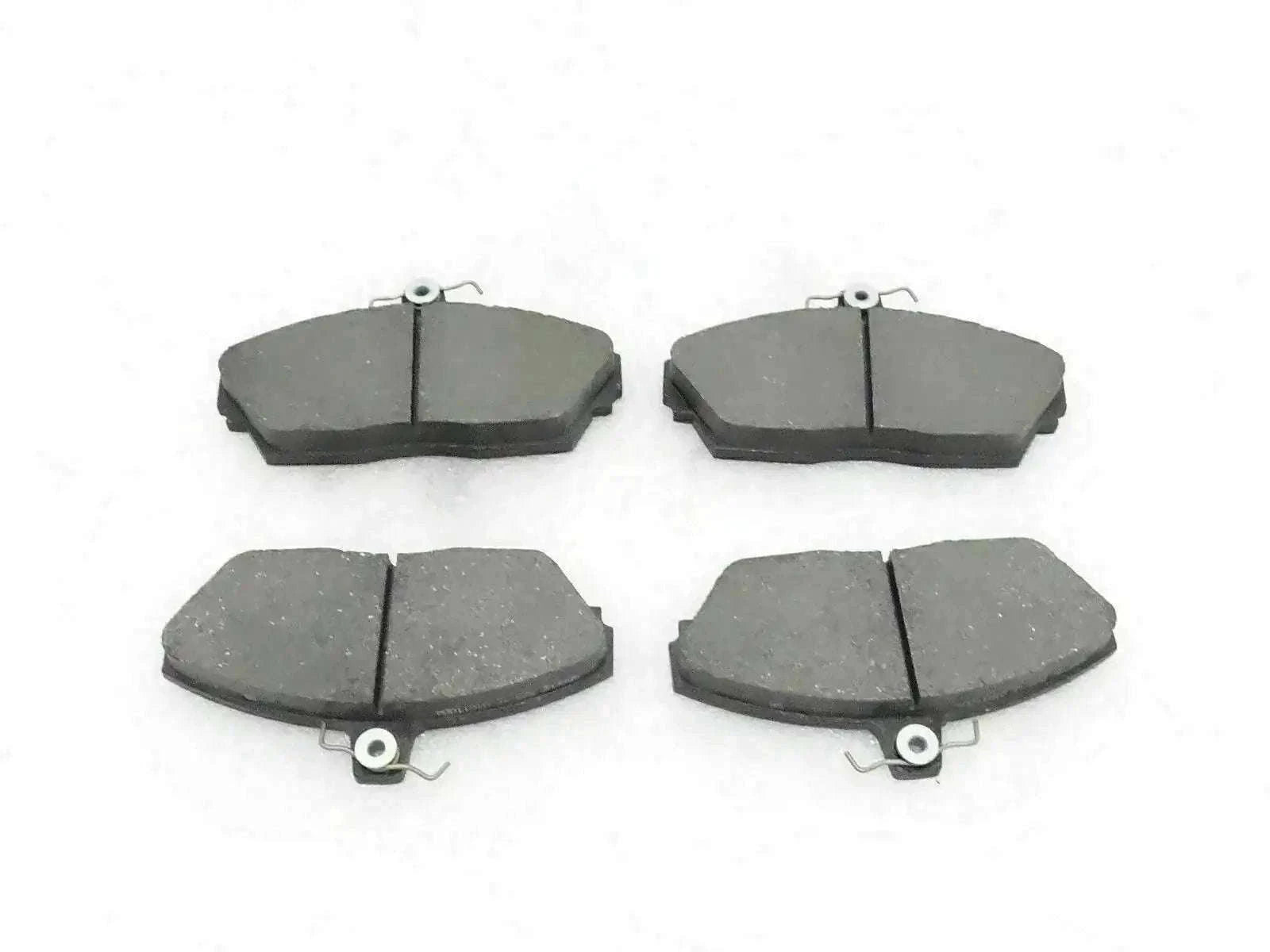 Disc brake pad set with four dark gray brake pads