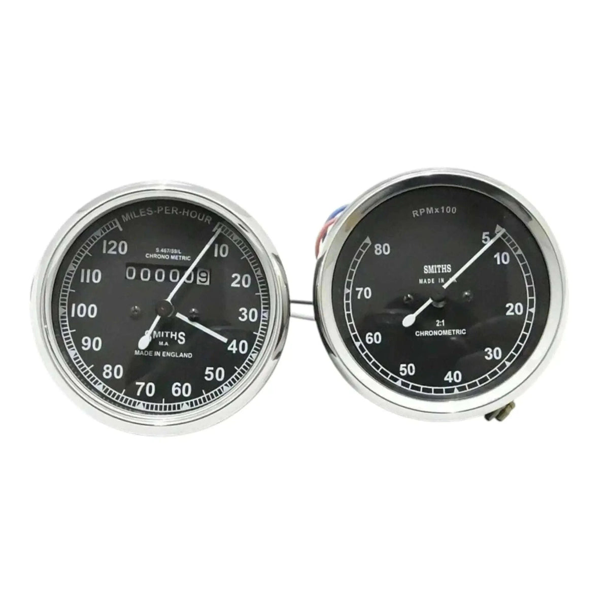 Speedometer gauge pair with chrome bezels, dual dials for mph and tach