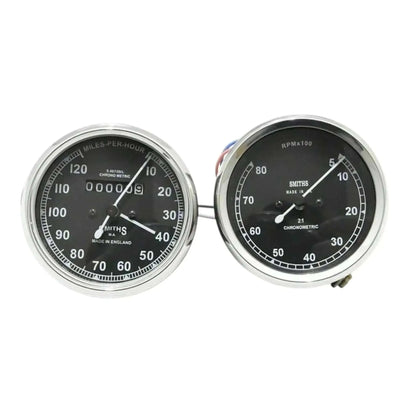 Speedometer gauge pair with chrome bezels, dual dials for mph and tach