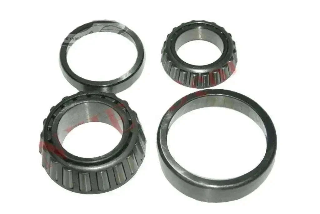 Front wheel bearing kit set with four metal bearing rings and roller assemblies
