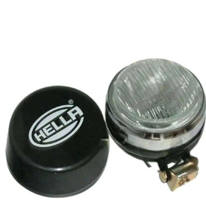 Hella fog lamp with clear lens and black cover, bulb holder visible