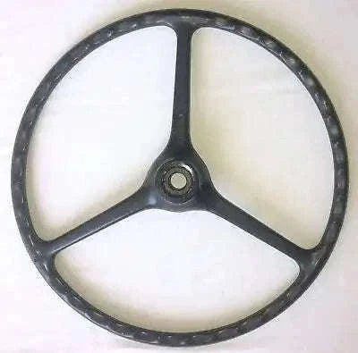 Black three-spoke steering wheel with center hub and textured rim