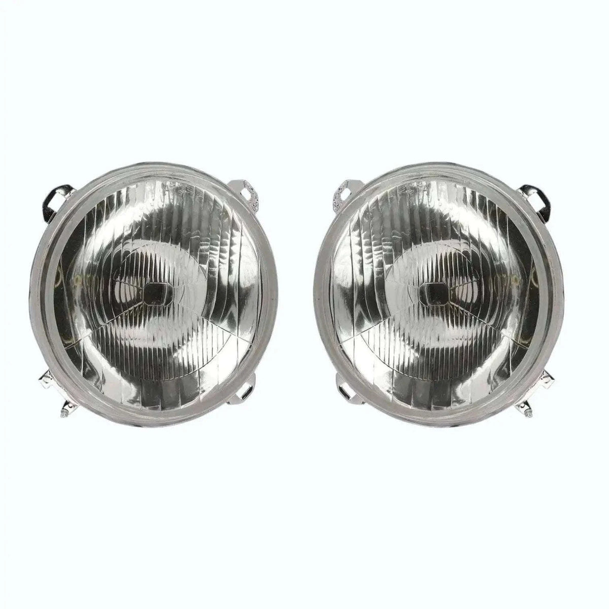 Pair of round headlight lamps with chrome reflector and clear glass cover