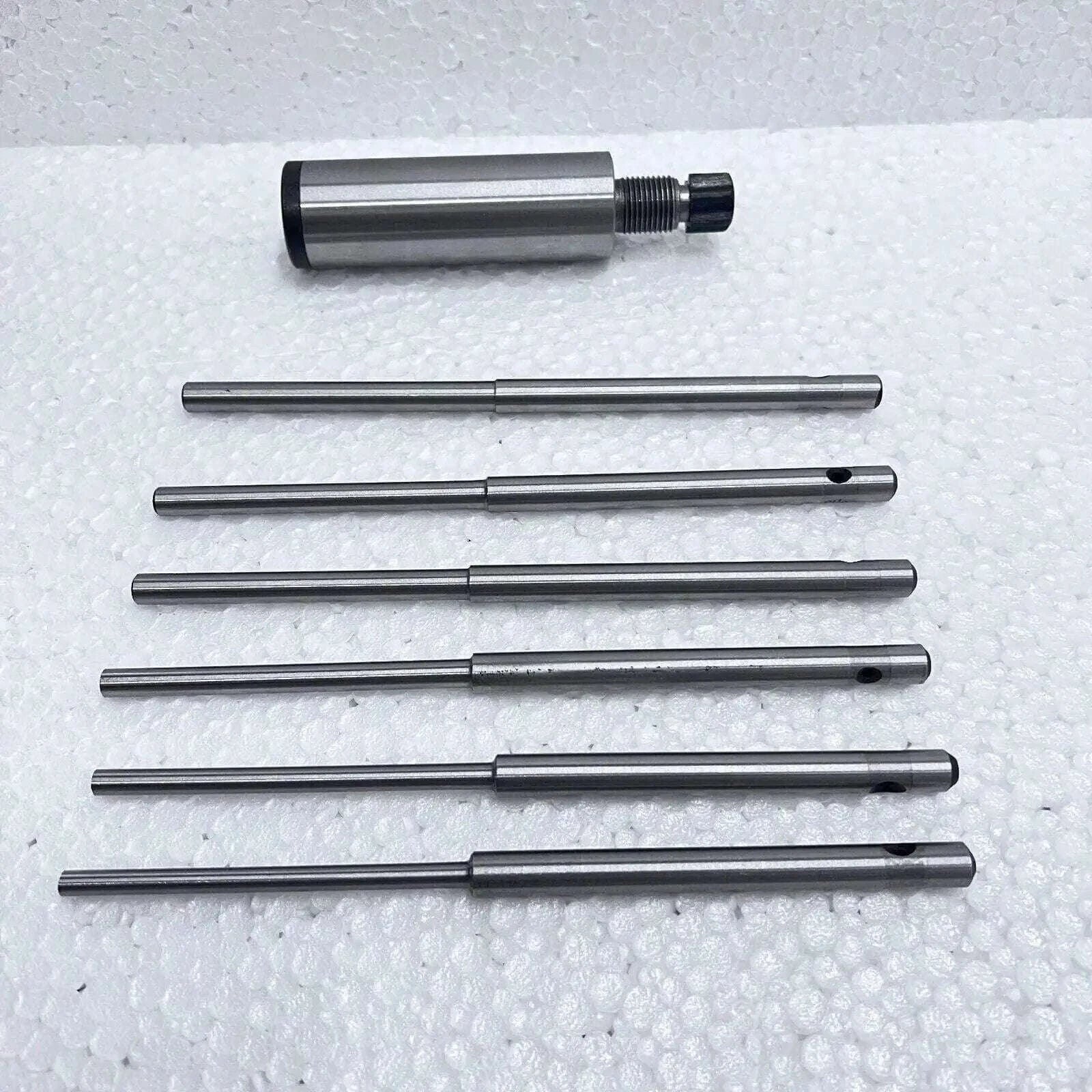 Valve seat grinding stone holder, steel, includes multiple grinding pilots for precision use