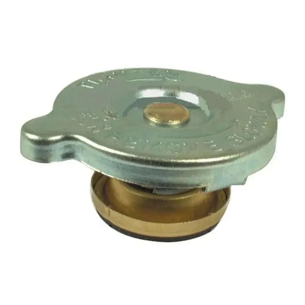 Radiator cap with brass center and greenish metal body, flat top and vent slot
