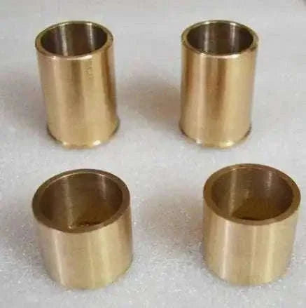 Set of four brass fork bushings designed for use with fork bushing removal tool in vehicle maintenance
