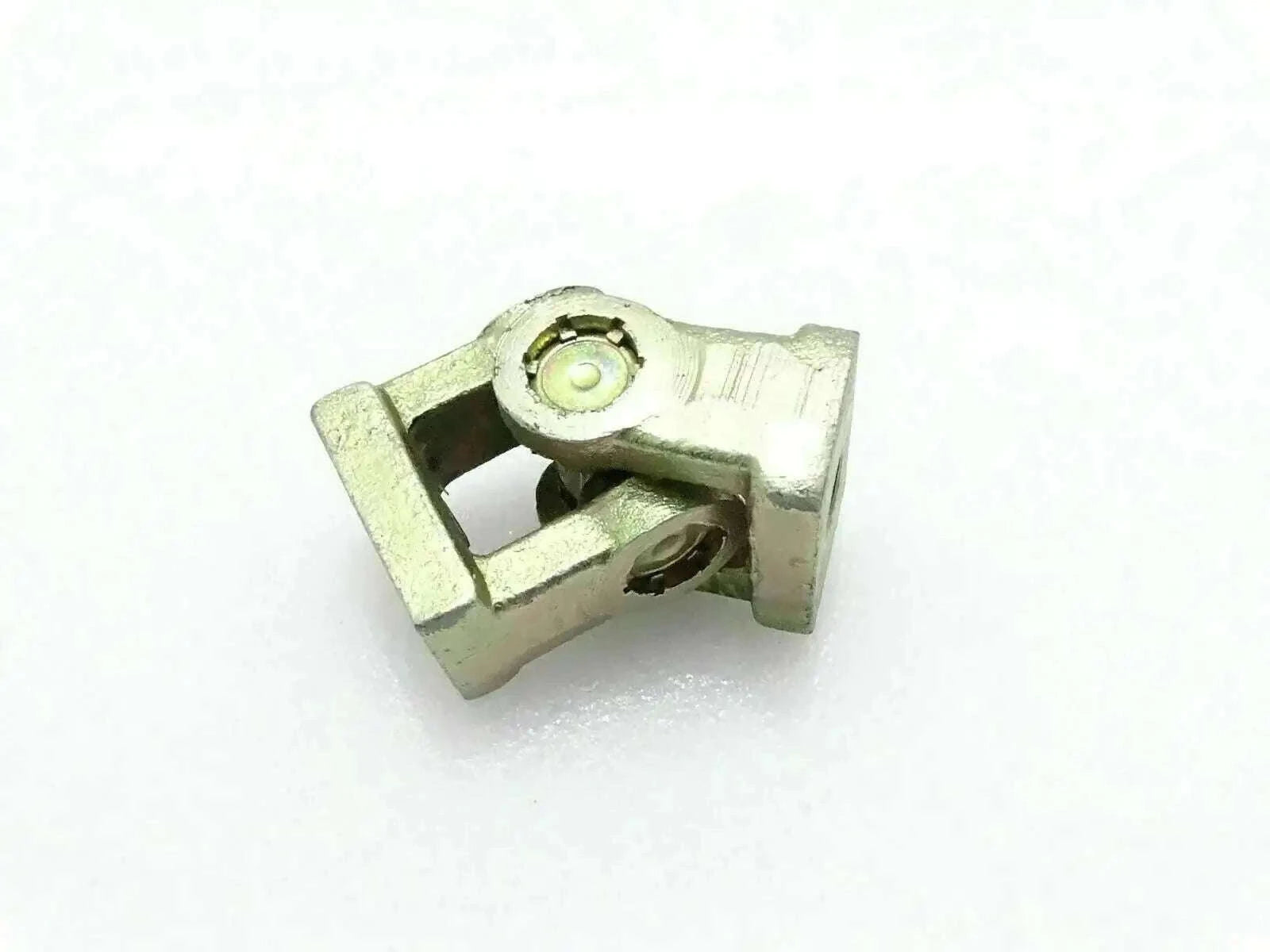 Universal joint yoke connector with greased bearing and mounting bolt