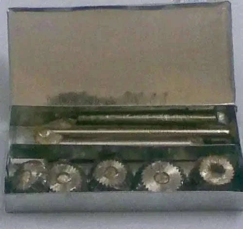Valve seat cutter set, carbon steel, in metal case with 5 cutting heads and tools.