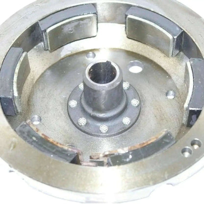 Metal flywheel housing with central hub and mounting points