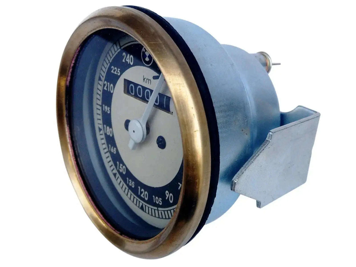 Speedometer gauge with brass bezel, blue and cream dial, km/h scale, needle visible