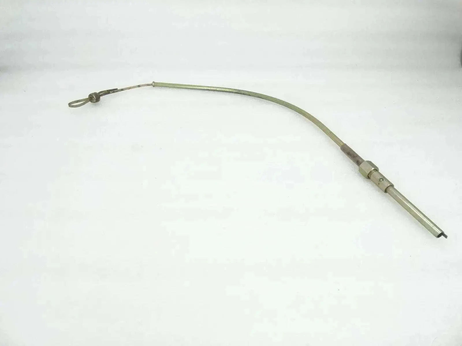 Engine oil dipstick gauge tube with loop handle and connector